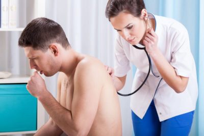 coughing man having examination